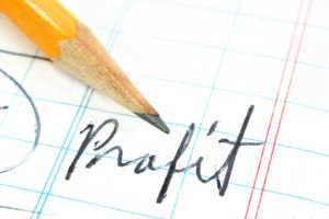 accounting ledger with pencil and word PROFIT